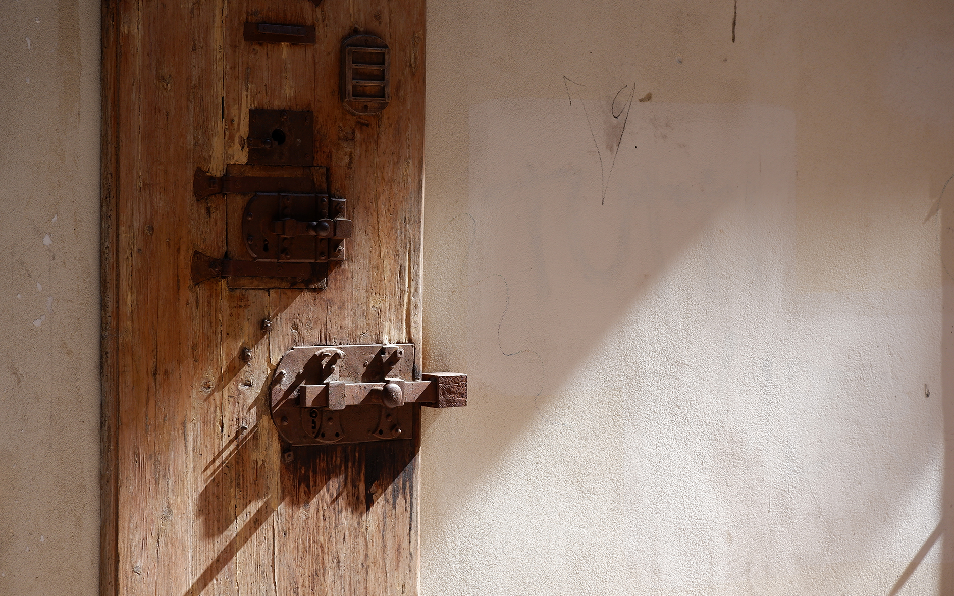 A wooden door of the former prison Le Murate.